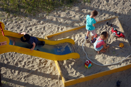 Kyiv, Ukraine June 20, 2022: Children play outside in the playgroundのeditorial素材