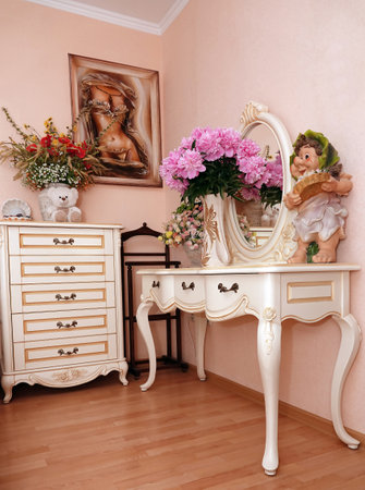 Kiev, Ukraine June 12, 2021: interior of a room with carved Italian furniture, chest of drawers and dressing table, made in classic styleのeditorial素材