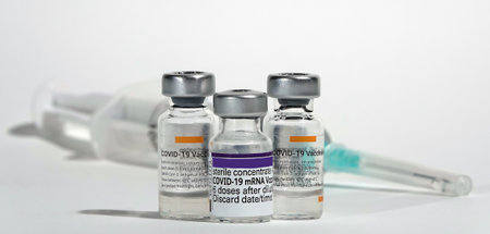 COVID-19 coronavirus vaccine and syringe filled for vaccinationのeditorial素材