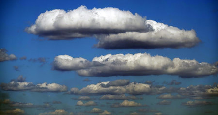 Sky with beautiful cumulus clouds conveying volume and distance