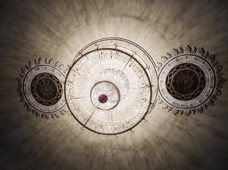 Kyiv, Ukraine, May 31, 2025: Antique crystal chandelier in the interior of an ancient building in Kyivの写真素材