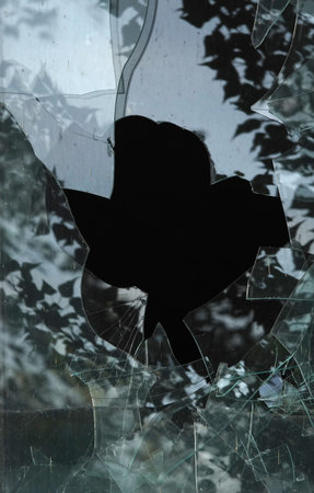 Kyiv, Ukraine, October 13, 2025: Broken window glass of a high-rise buildingの写真素材
