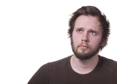 Man thinking or wondering. Isolated on white with copy-space.の写真素材