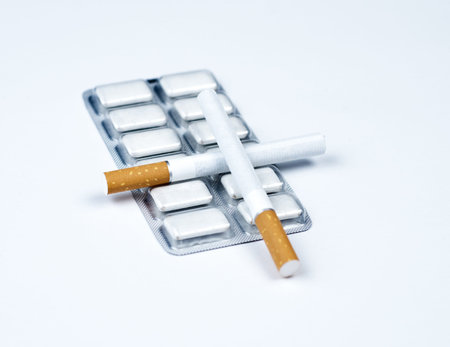 Nicotine gum and crossed tobacco.の写真素材