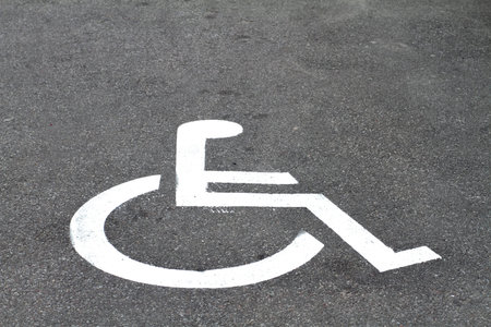 closeup invalid sign on parking asphalt