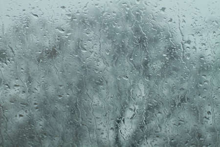 close up rain drops on wet windshield glassの写真素材