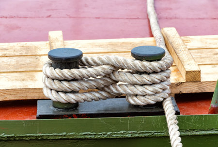 Mooring bollard with a fixed rope on the river ship 