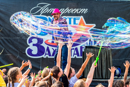 Volgodonsk, Russia-August 25, 2019: bubble show Festival, art project Ignite together. Young bright...