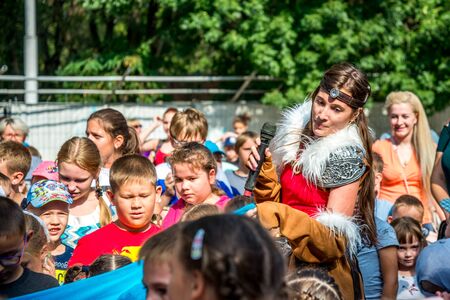 Volgodonsk, Russia-August 25, 2019: bubble show festival, art project ignite together. Holiday in the Park, children play competitions, jump, dance and smile happily. The animator entertains kidsのeditorial素材