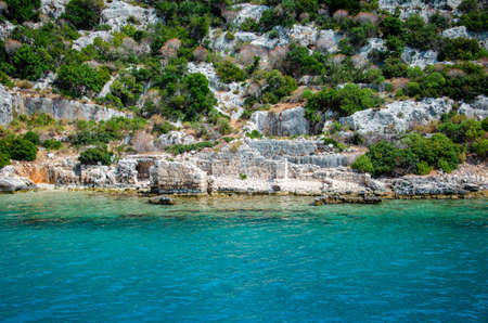 Ruins of the ancient sunken Lycian underwater city of Dolichiste on the island of Kekova. Attraction of the Mediterranean sea under water. Sea tour near Demre and Semena. Antalya Province, Turkeyの写真素材