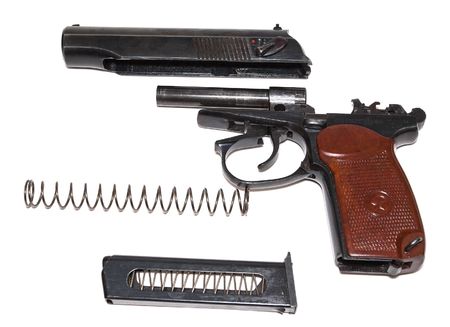 Disassembled handgun on a white backgroundの写真素材