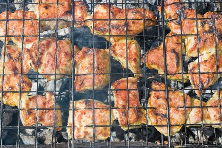 Close up of cooking meat on the open fireの写真素材