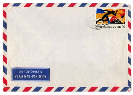 Vintage dirty airmail envelope on white backgroundの写真素材