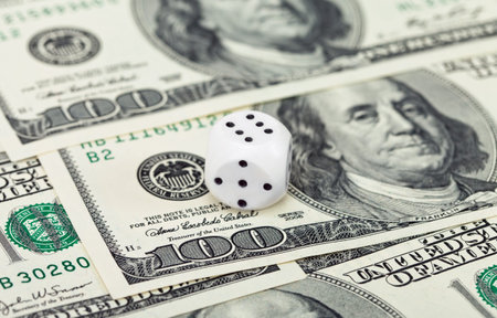 Dices on money background - business concept