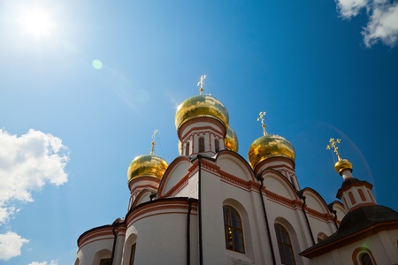 Cupolas of Russian orthodox church against blue skyの写真素材