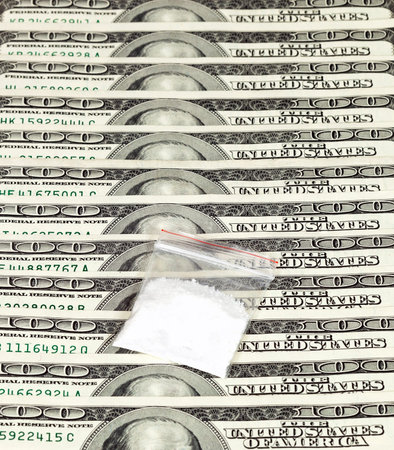 Package with drug over the U.S. dollars background