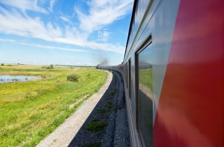 Train goes by rail in summer day, countryside.のeditorial素材