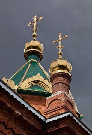 Cupolas of Russian orthodox church against dark skyの写真素材