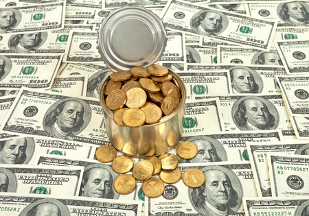 Russian  coins in the can over US banknotes backgroundの写真素材