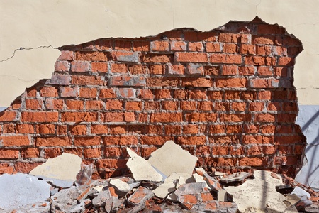 Old weathered red brick wall as backgroundの写真素材