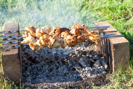 Shish kebab on the improvised oven made of brickの写真素材