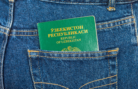 Uzbekistan passport in the back jeans pocketの写真素材