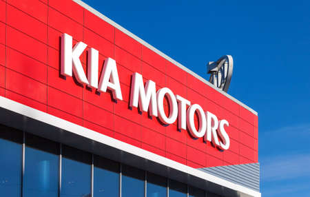 SAMARA, RUSSIA - OCTOBER 20: The emblem KIA motors on blue sky background, October 20, 2013 in Samara, Russia. Kia Motors, headquartered in Seoul, is South Korea's second-largest automobile manufacturerのeditorial素材