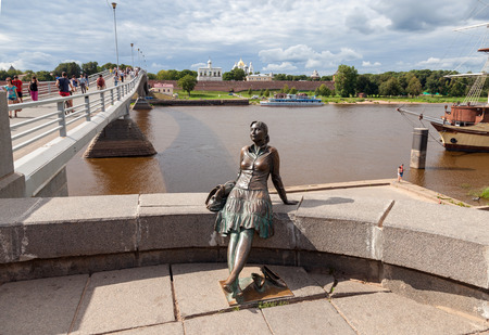 NOVGOROD, RUSSIA - AUGUST 10: Monument to tourist girl on August 10, 2013 in Veliky Novgorod. Veliky Novgorod - famous ancient Russian city, was founded in 859 のeditorial素材