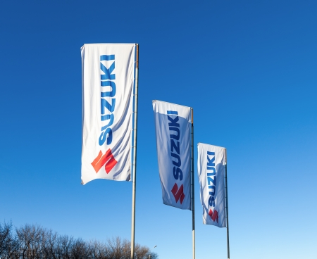 SAMARA, RUSSIA - NOVEMBER 24: The flags with emblem Suzuki over blue sky, November 24, 2013 in Samara, Russia. Suzuki Motor Corporation is a Japanese multinational corporation headquartered in Minami-ku, Hamamatsu, Japanのeditorial素材