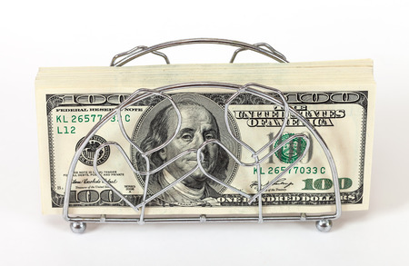 Napkin holder with pile of one hundred dollar billsの写真素材