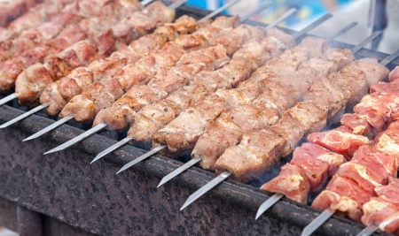 Preparation of meat slices in sauce on fireの写真素材
