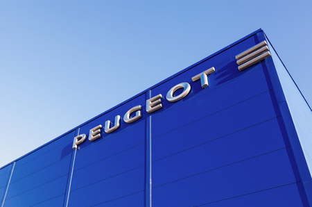 SAMARA, RUSSIA - NOVEMBER 24, 2013: The emblem Peugeot on the building of official dealer. Peugeot is a French car brand, part of PSA Peugeot Citroen.のeditorial素材
