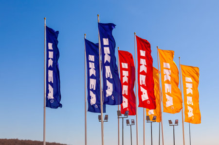 SAMARA, RUSSIA - APRIL 19, 2014: IKEA flags against sky at the IKEA Samara Store. IKEA is the...
