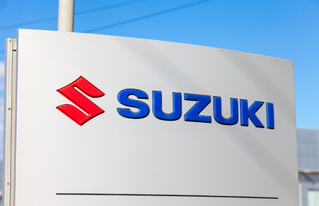 SAMARA, RUSSIA - AUGUST 30, 2014: Suzuki dealership sign against blue sky. Suzuki Motor Corporation is a Japanese multinational corporationのeditorial素材