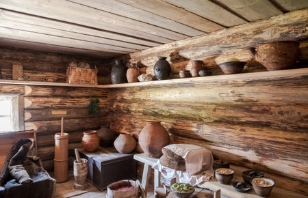 NOVGOROD, RUSSIA - JULY 23, 2014: Interior of old rural wooden house in the museum of wooden architecture Vitoslavlitsy. Wooden buildings dating from the 14th to the 19th century in museumのeditorial素材