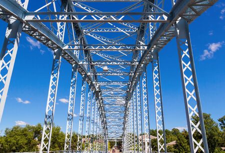 Detail of steel arch bridge across river Msta. Novgorod region, Russiaの写真素材