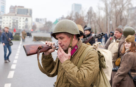 SAMARA, RUSSIA - NOVEMBER 7, 2014: Member of Historical reenactment in Soviet Army uniform after battle. The battle he is reenacting was the Moscow Battle held in 1941.のeditorial素材
