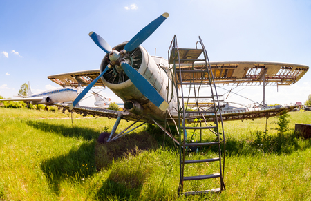 SAMARA, RUSSIA - MAY 25, 2014: Old russian aircraft An-2 at an abandoned aerodrome in summertime. The Antonov An-2 is a Soviet mass-produced single-engine biplaneのeditorial素材