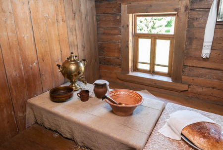 NOVGOROD, RUSSIA - JULY 23, 2014: Interior of old rural wooden house in the museum of wooden architecture Vitoslavlitsy. Wooden buildings dating from the 14th to the 19th century in museumのeditorial素材