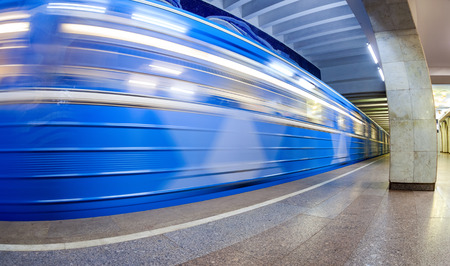 Blue subway train in motion at the underground station. Wide angleのeditorial素材