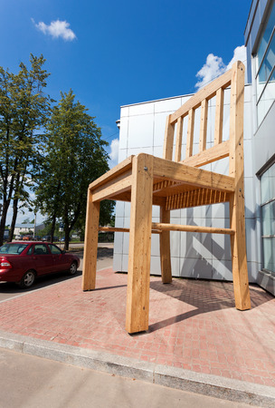 BOROVICHI, RUSSIA - JULY 20, 2014: Large chair wooden sculpture near the furniture factory in sunny dayのeditorial素材