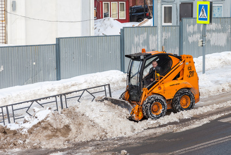 SAMARA, RUSSIA - FEBRUARY 8, 2015: Snow cleaning pavements and streets of city which are covered in snow during heavy snowfallのeditorial素材