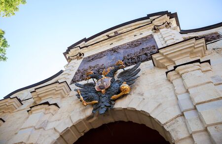 Two-headed eagle with scepter and orb above the main gate Peter and Paul Fortress  in Saint Petersburg, Russiaの写真素材