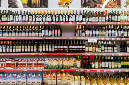 SAMARA, RUSSIA - APRIL 12, 2015: Showcase alcoholic beverages at the hypermarket Magnet. Russia's largest retailer. It was founded in 1994 in Krasnodarのeditorial素材