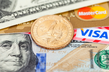 SAMARA, RUSSIA - MARCH 2, 2015: Photo of VISA and Mastercard credit card with american dollarsのeditorial素材