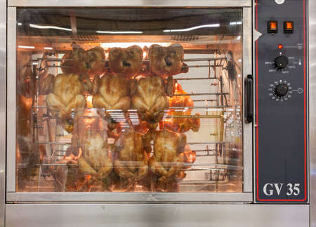 SAMARA, RUSSIA - MAY 30, 2015: Grilled chicken in the big barbecue grillのeditorial素材