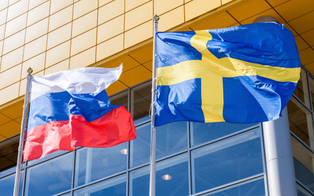 SAMARA, RUSSIA - JUNE 14, 2015: Flags of Sweden and Russia waving against IKEA store