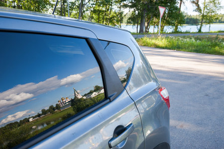 Iversky monastery is reflected in a side window of the carの写真素材