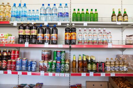 BOROVICHI, RUSSIA - JULY 15, 2015: Showcase with different beverages at the grocery store in Russian villageのeditorial素材
