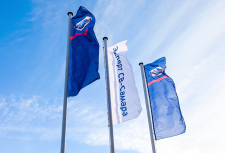 SAMARA, RUSSIA - MARCH 1, 2015: The flags of official dealer Datsun over blue sky. Datsun is an automobile brand owned by the Nissan Motor Companyのeditorial素材